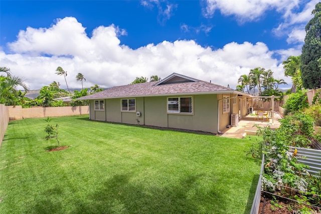 464 Poipu Dr, Honolulu, HI 96825 - rear view of property featuring stucco siding, a patio area, and roof with shingles