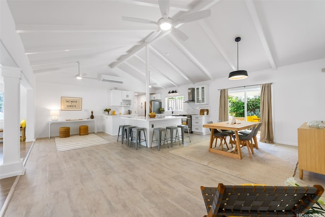 464 Poipu Dr, Honolulu, HI 96825 - dining room featuring a ceiling fan, light wood-type flooring, and an AC wall unit