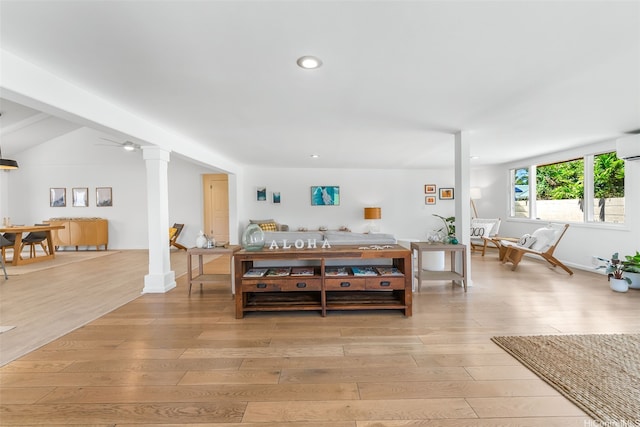 464 Poipu Dr, Honolulu, HI 96825 - living area with decorative columns, light wood-style flooring, recessed lighting, and a wall unit AC