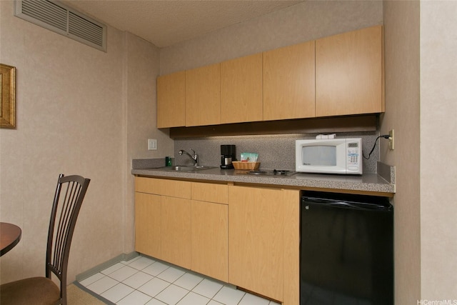 1088 Bishop St Unit 2201, Honolulu, HI 96813 - kitchen with white microwave, light brown cabinets, dishwasher, light tile patterned flooring, and fridge