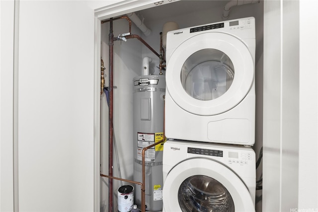 987 Queen St Unit 1615, Honolulu, HI 96814 - laundry area featuring stacked washer and clothes dryer and water heater