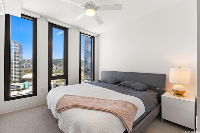 987 Queen St Unit 1615, Honolulu, HI 96814 - carpeted bedroom with baseboards and ceiling fan