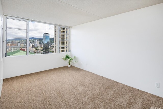 400 Hobron Ln Unit 2412, Honolulu, HI 96815 - carpeted spare room featuring a view of city