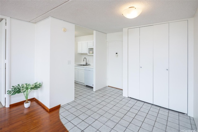 400 Hobron Ln Unit 2412, Honolulu, HI 96815 - unfurnished living room with a textured ceiling and light wood finished floors