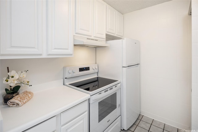 400 Hobron Ln Unit 2412, Honolulu, HI 96815 - kitchen with white electric stove, under cabinet range hood, white cabinets, light tile patterned flooring, and light countertops