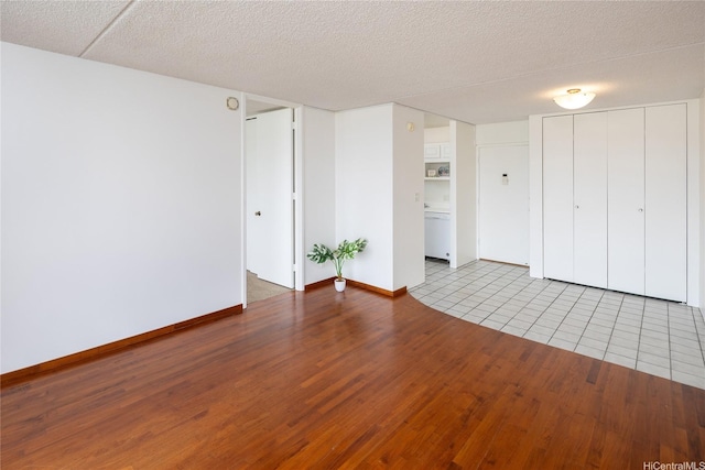 400 Hobron Ln Unit 2412, Honolulu, HI 96815 - unfurnished living room with wood finished floors and a textured ceiling