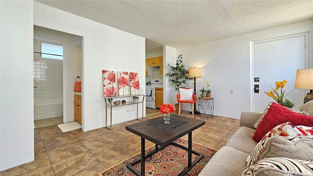 99-015 Kalaloa St Unit 807, Aiea, HI 96701 - living room featuring a textured ceiling and light tile patterned flooring