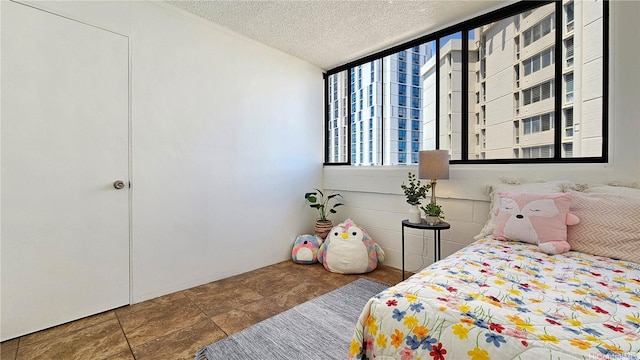 99-015 Kalaloa St Unit 807, Aiea, HI 96701 - bedroom with multiple windows and a textured ceiling