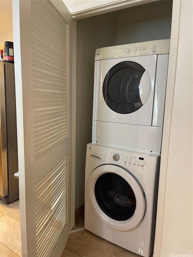95-965 Ukuwai St Unit 3602, Mililani, HI 96789 - laundry area with stacked washing machine and dryer and tile patterned floors