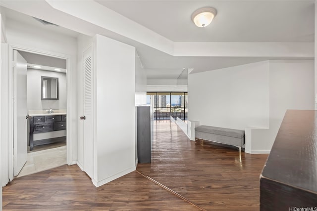 1221 Victoria St Unit 1705, Honolulu, HI 96814 - hallway featuring dark wood-type flooring and baseboards