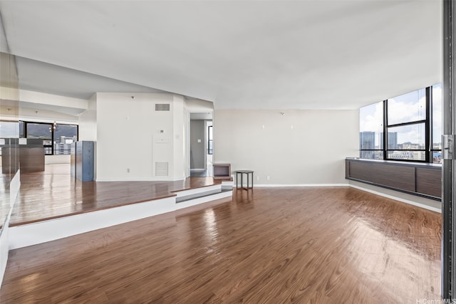 1221 Victoria St Unit 1705, Honolulu, HI 96814 - unfurnished living room featuring wood finished floors and baseboards