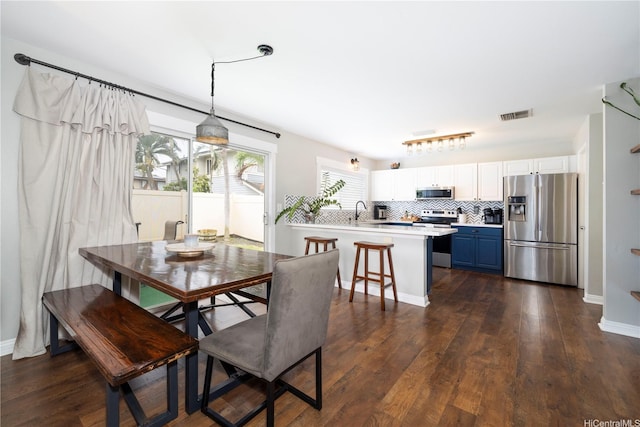91-1013 Kailike St, Ewa Beach, HI 96706 - dining area with dark wood-type flooring and baseboards