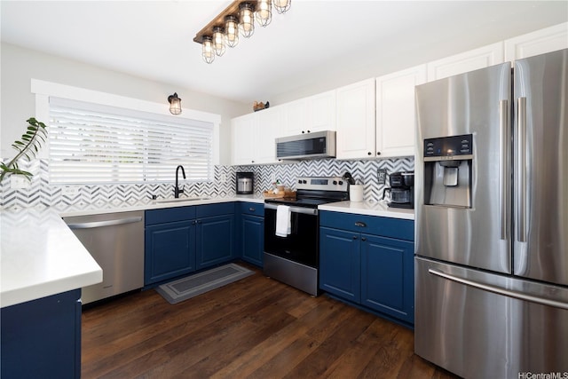 91-1013 Kailike St, Ewa Beach, HI 96706 - kitchen featuring stainless steel appliances, blue cabinets, a sink, decorative backsplash, and light countertops