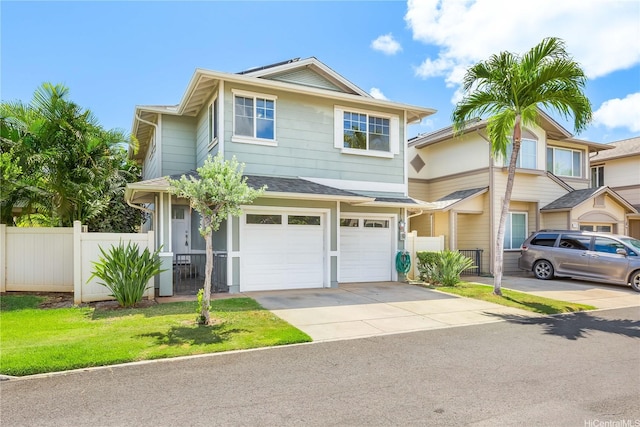 91-1083 Kanela St Unit T22, Ewa Beach, HI 96706 - view of front facade with driveway, a garage, and roof with shingles