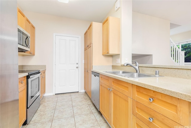 91-1083 Kanela St Unit T22, Ewa Beach, HI 96706 - kitchen featuring appliances with stainless steel finishes, light brown cabinetry, light tile patterned floors, and light stone countertops