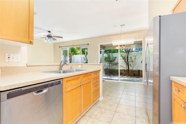 91-1083 Kanela St Unit T22, Ewa Beach, HI 96706 - kitchen with appliances with stainless steel finishes, a ceiling fan, light tile patterned floors, light countertops, and hanging light fixtures
