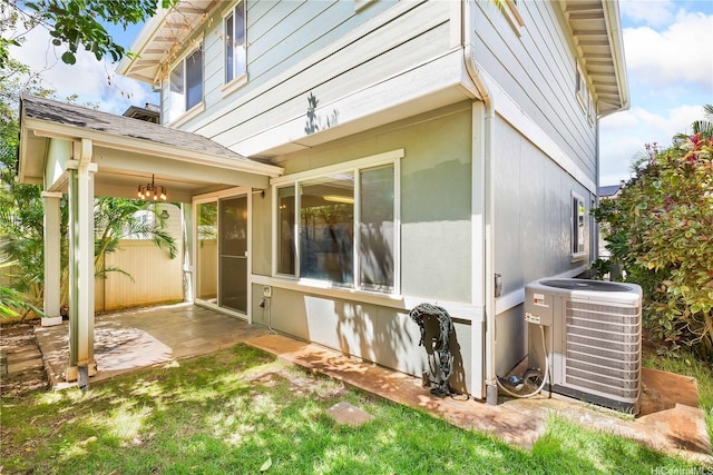 91-1083 Kanela St Unit T22, Ewa Beach, HI 96706 - view of side of home with a central air condition unit and a patio