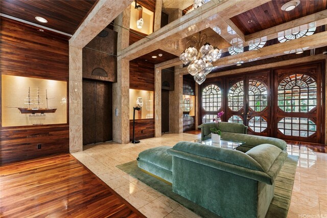 1525 Wilder Ave Unit 903, Honolulu, HI 96822 - living area with a towering ceiling, wood ceiling with exposed beams, wooden walls, and wood finished floors