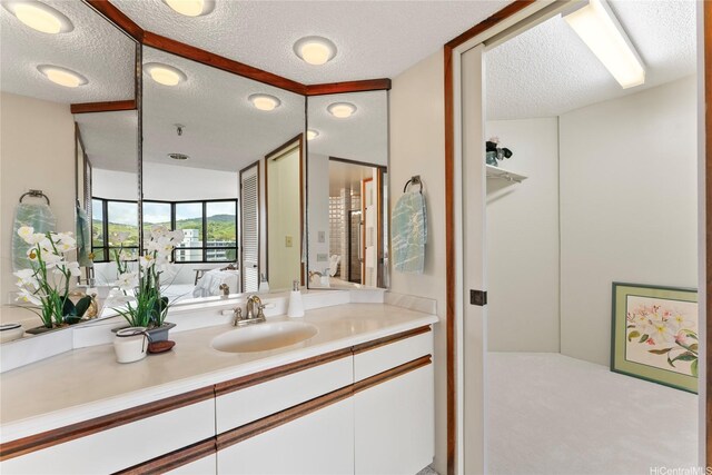 1525 Wilder Ave Unit 903, Honolulu, HI 96822 - ensuite bathroom with a textured ceiling, vanity, and a closet