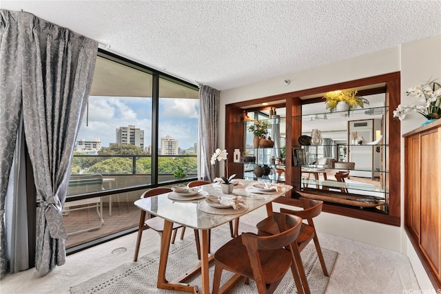 1525 Wilder Ave Unit 903, Honolulu, HI 96822 - dining space with a textured ceiling, plenty of natural light, and a city view