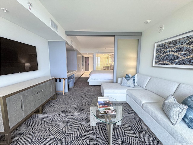 383 Kalaimoku St Unit 1807, Honolulu, HI 96815 - living area with dark carpet