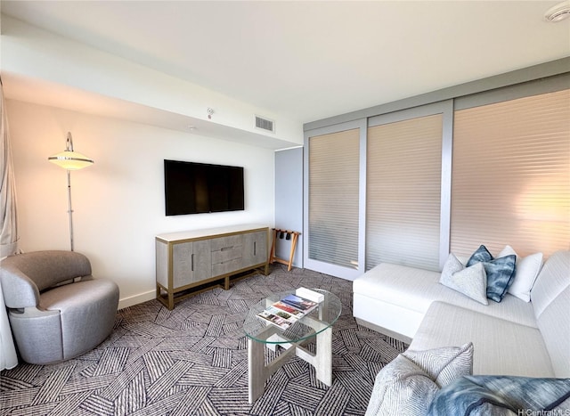 383 Kalaimoku St Unit 1807, Honolulu, HI 96815 - living room featuring carpet flooring and baseboards