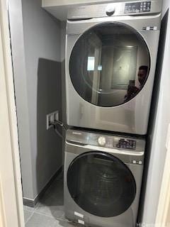 98-99 Uao Pl Unit 1710, Aiea, HI 96701 - washroom featuring stacked washer / drying machine and light tile patterned flooring