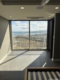 98-99 Uao Pl Unit 1710, Aiea, HI 96701 - unfurnished room with a wall of windows, recessed lighting, and a water view