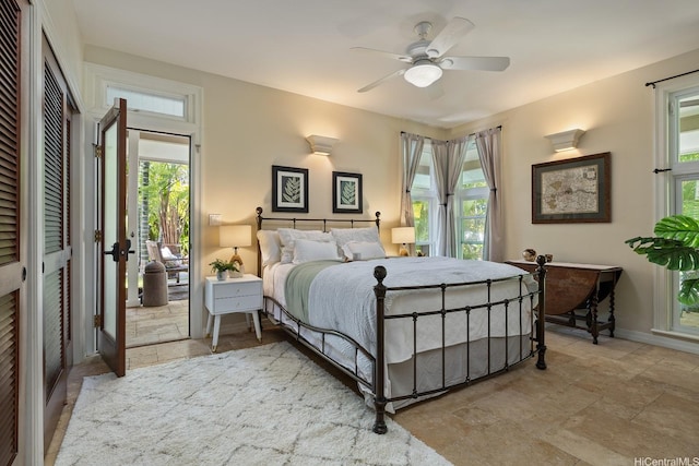 876 Aalapapa Dr Unit B, Kailua, HI 96734 - bedroom featuring stone tile flooring, multiple windows, baseboards, and ceiling fan