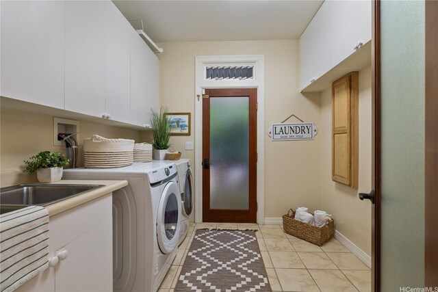 876 Aalapapa Dr Unit B, Kailua, HI 96734 - laundry area with cabinet space, independent washer and dryer, light tile patterned floors, and baseboards