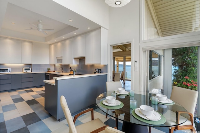 120 Hanapepe Loop, Honolulu, HI 96825 - kitchen with modern cabinets, gray cabinets, light countertops, light floors, and white cabinets