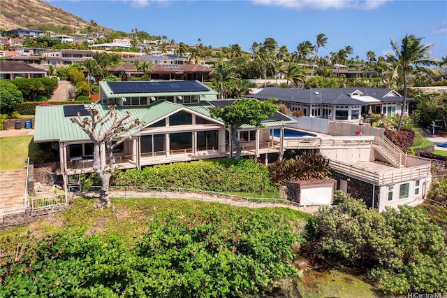 120 Hanapepe Loop, Honolulu, HI 96825 - back of property featuring roof mounted solar panels and metal roof