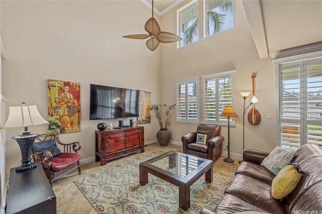 92-1037D Koio Dr Unit M1-4, Kapolei, HI 96707 - living room featuring ceiling fan, plenty of natural light, crown molding, baseboards, and a high ceiling