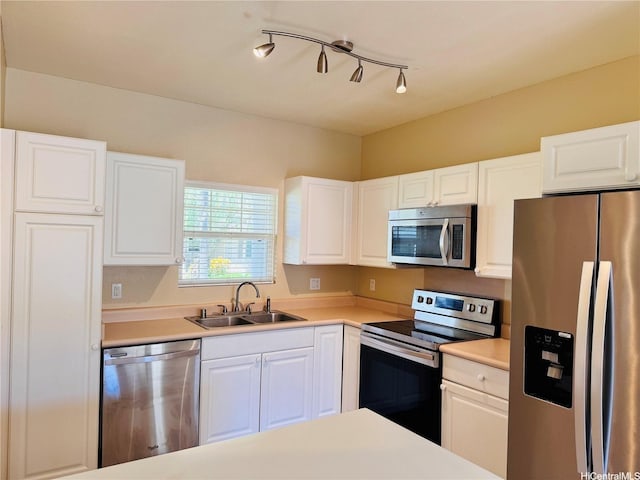 91-1014 Kaipalaoa St Unit 6504, Ewa Beach, HI 96706 - kitchen with stainless steel appliances, a sink, white cabinets, and light countertops