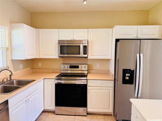 91-1014 Kaipalaoa St Unit 6504, Ewa Beach, HI 96706 - kitchen featuring appliances with stainless steel finishes, a sink, white cabinets, and light countertops