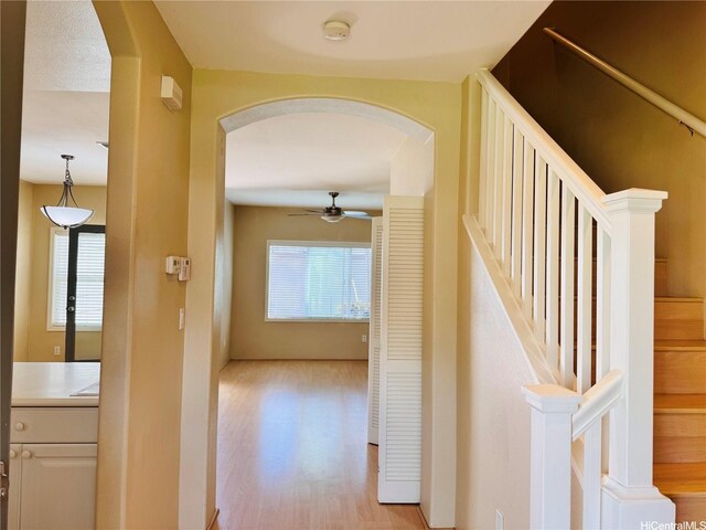 91-1014 Kaipalaoa St Unit 6504, Ewa Beach, HI 96706 - hall featuring arched walkways, light wood-style flooring, and stairway