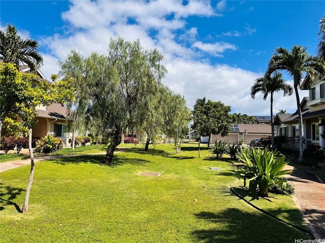 91-1014 Kaipalaoa St Unit 6504, Ewa Beach, HI 96706 - surrounding community with a lawn