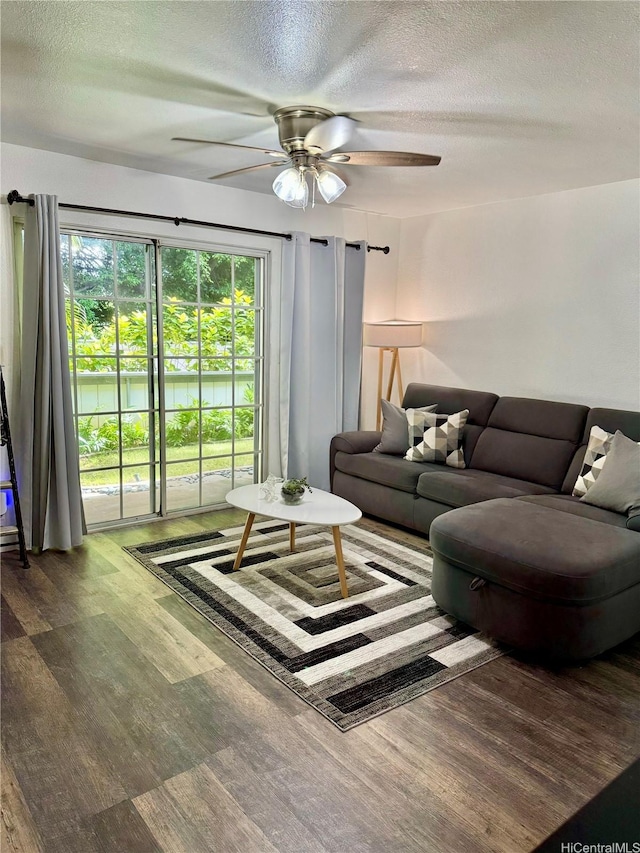 645 Mananai Pl Unit 23Bd, Honolulu, HI 96818 - living room featuring a textured ceiling, a ceiling fan, and wood finished floors