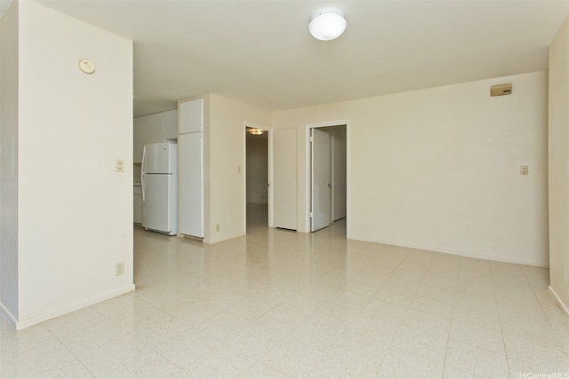 3516 Ala Aloalo Pl, Honolulu, HI 96818 - empty room featuring baseboards, a smoke detector, and light floors