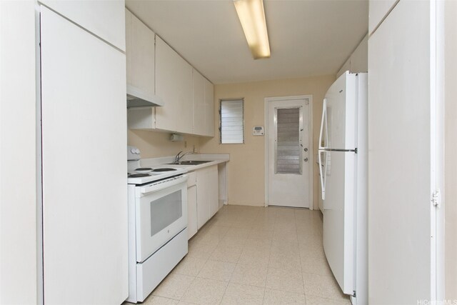 3516 Ala Aloalo Pl, Honolulu, HI 96818 - kitchen featuring white appliances, a sink, under cabinet range hood, light countertops, and white cabinetry
