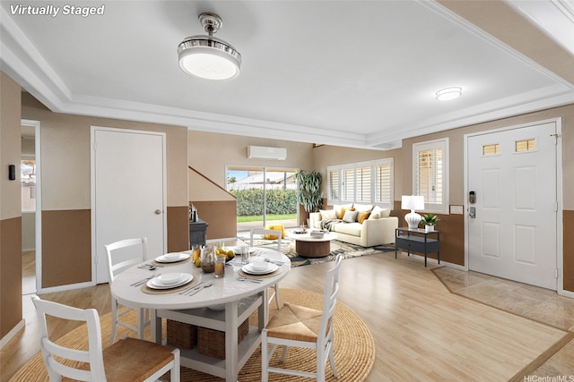 91-272 Kaieleele Pl, Ewa Beach, HI 96706 - dining area featuring a wall mounted AC, light wood-style floors, and baseboards