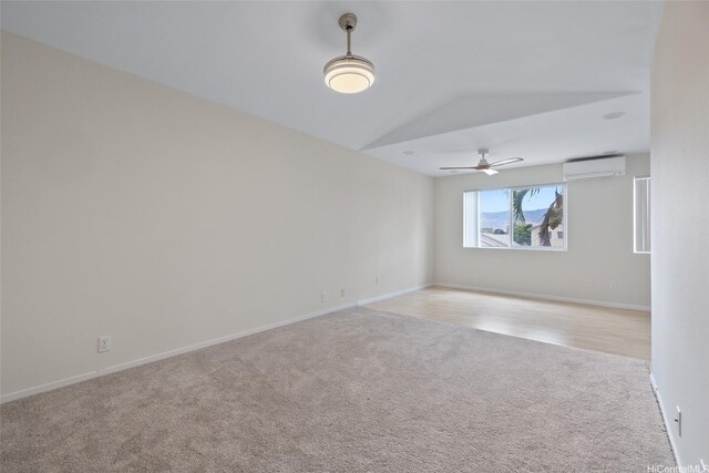 91-272 Kaieleele Pl, Ewa Beach, HI 96706 - spare room with a wall unit AC, light colored carpet, a ceiling fan, baseboards, and lofted ceiling