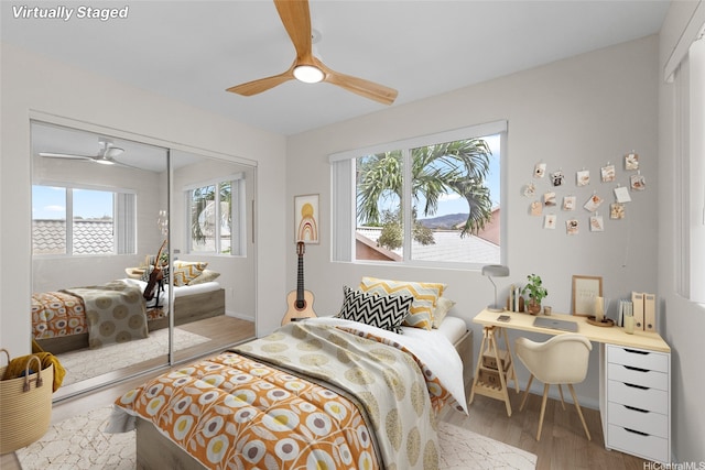 91-272 Kaieleele Pl, Ewa Beach, HI 96706 - bedroom featuring a closet, wood finished floors, a ceiling fan, and baseboards