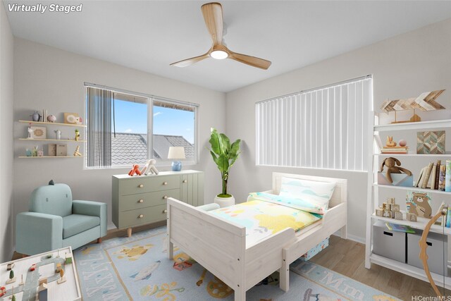 91-272 Kaieleele Pl, Ewa Beach, HI 96706 - bedroom with light wood-type flooring and a ceiling fan