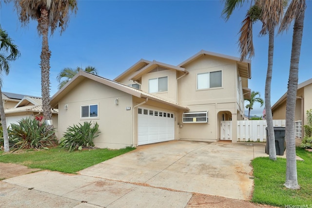 91-272 Kaieleele Pl, Ewa Beach, HI 96706 - view of front of house featuring stucco siding, driveway, and an attached garage