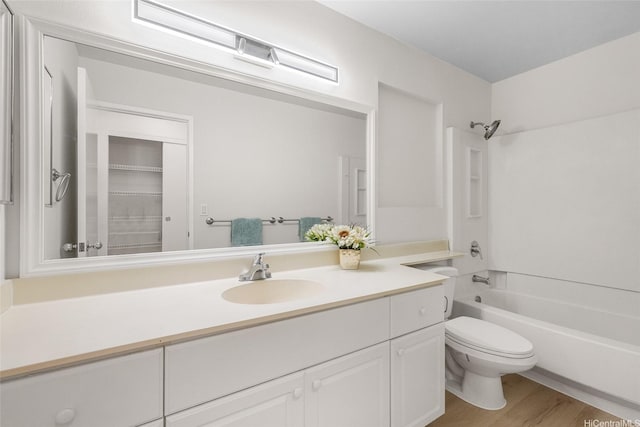 91-272 Kaieleele Pl, Ewa Beach, HI 96706 - bathroom featuring vanity, toilet, washtub / shower combination, and wood finished floors