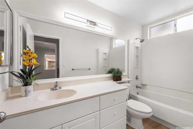 91-272 Kaieleele Pl, Ewa Beach, HI 96706 - bathroom with vanity, toilet, washtub / shower combination, and wood finished floors