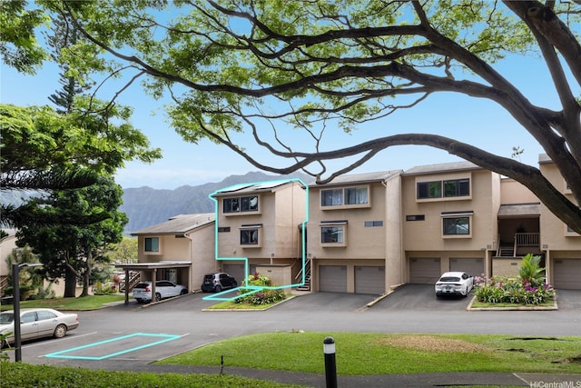 46-034 Puulena St Unit 722, Kaneohe, HI 96744 - view of property featuring a mountain view and an attached garage