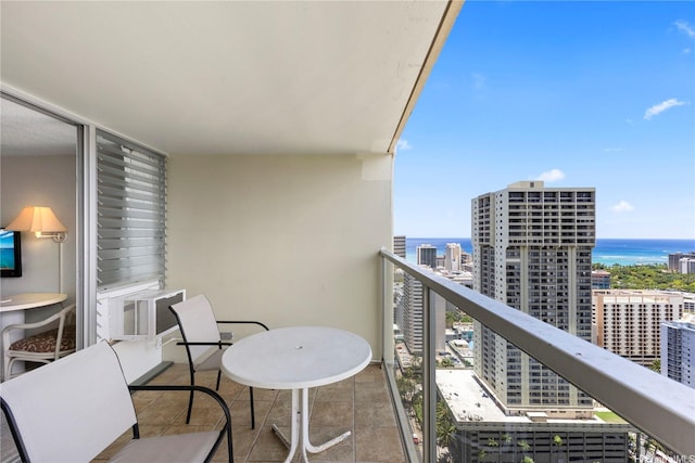 445 Seaside Ave Unit 3704, Honolulu, HI 96815 - balcony featuring a water view, cooling unit, and a city view