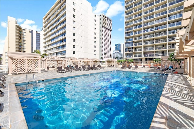 445 Seaside Ave Unit 3704, Honolulu, HI 96815 - community pool with a patio and a city view